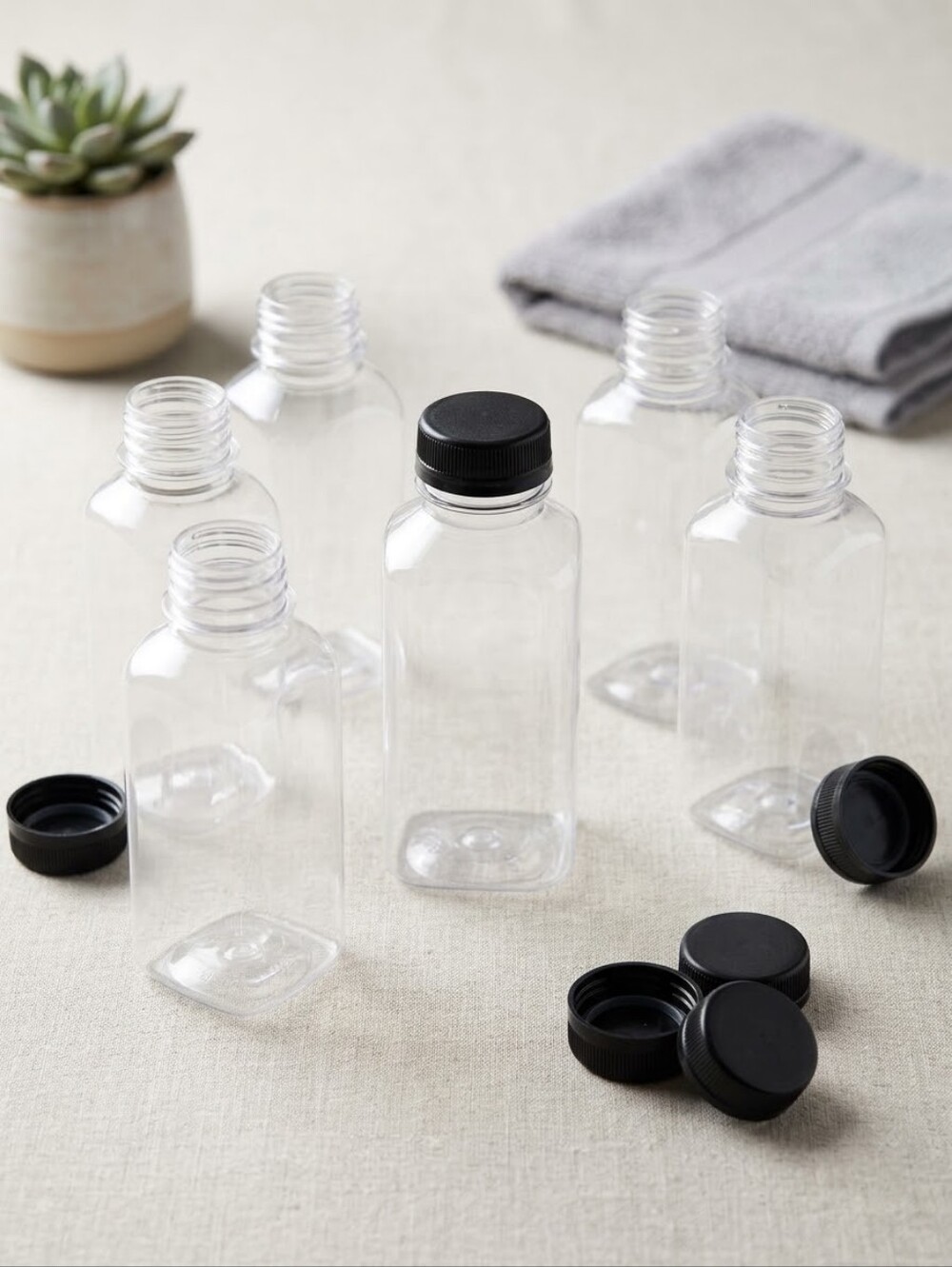 Clear & Black Plastic Storage Bottle